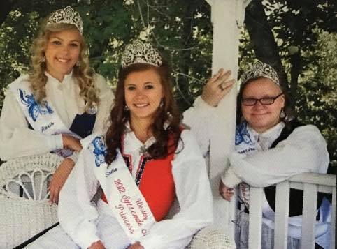 3 Female Students Posing with Crowns and Sashes